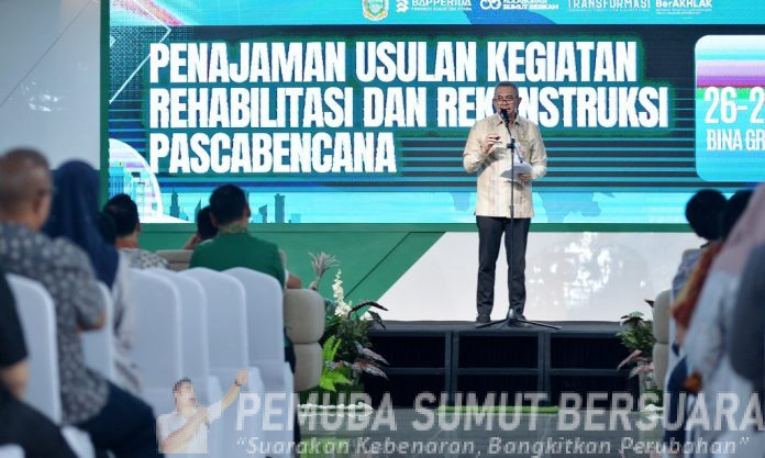 Teks Foto : Pj Sekretaris Daerah Provinsi Sumatera Utara (Sumut) Sulaiman Harahap membuka Rapat Koordinasi Penajaman Usulan Kegiatan Rehabilitasi dan Rekonstruksi Pascabencana Sumut dengan seluruh instansi terkait di Aula Binagraha Bapperida Provinsi Sumut Jalan Diponegoro Kota Medan, Kamis (26/3/2026). (Foto : Ist) 